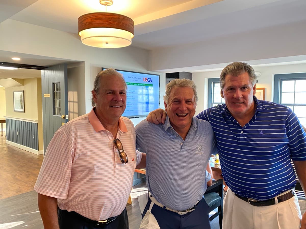 Members celebrating inside the clubhouse