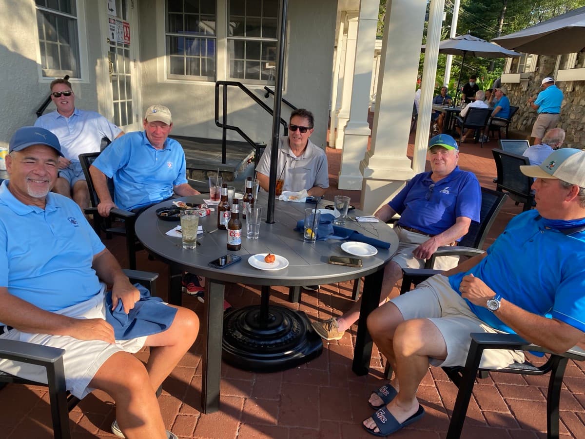 FOB members gathered on the sunny patio