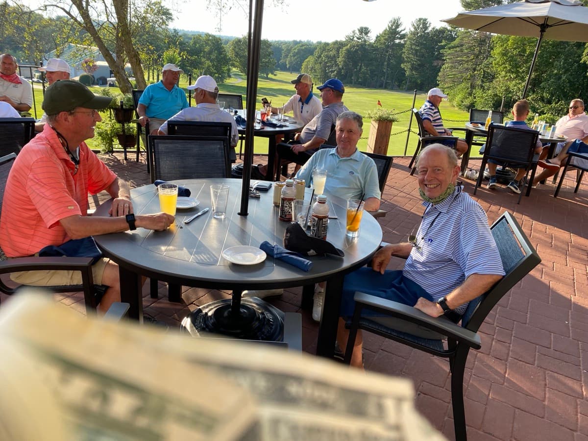 Members on the patio at golden hour