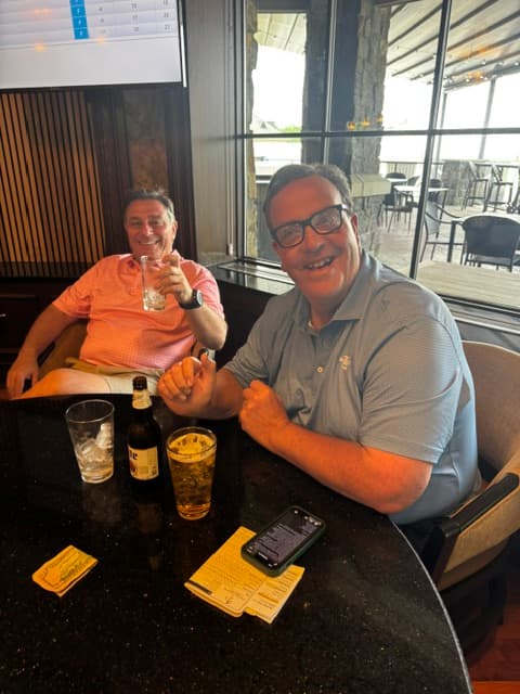 Members enjoying drinks at the clubhouse bar